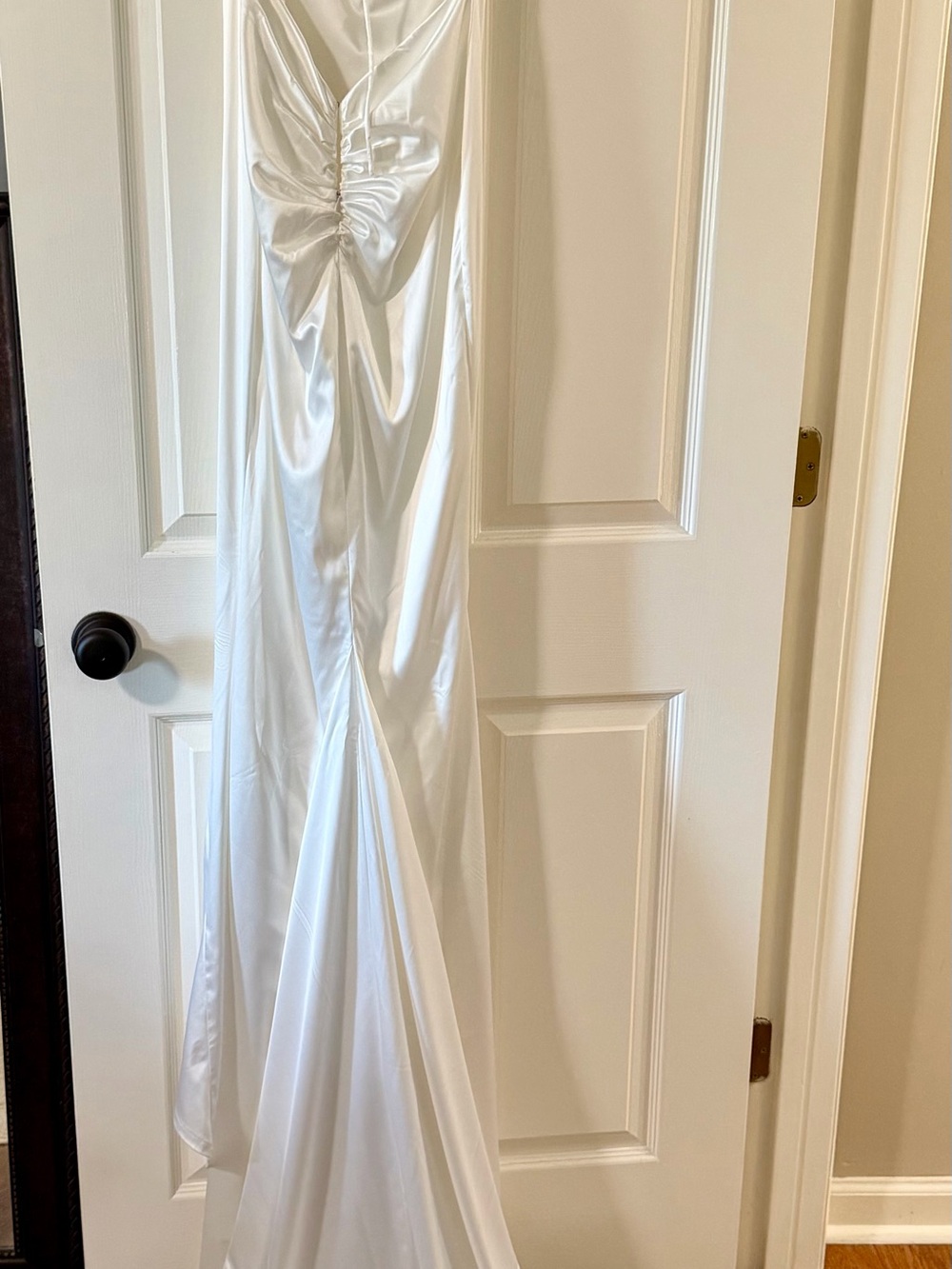 White satin wedding gown with train.